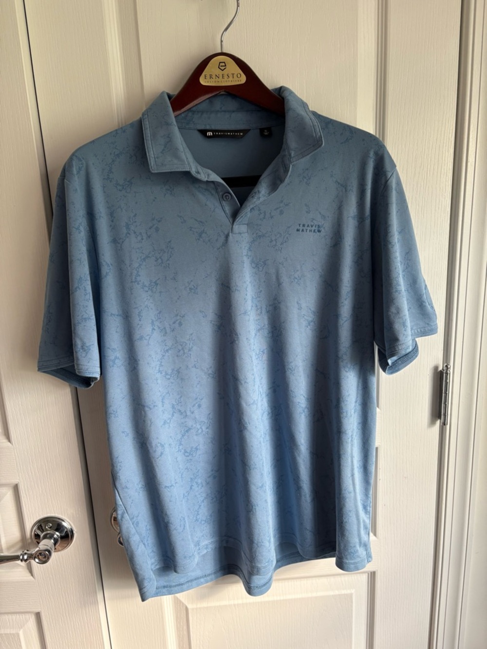 Travis Mathew Light Blue Performance Polo with St Andrews Links embroidery